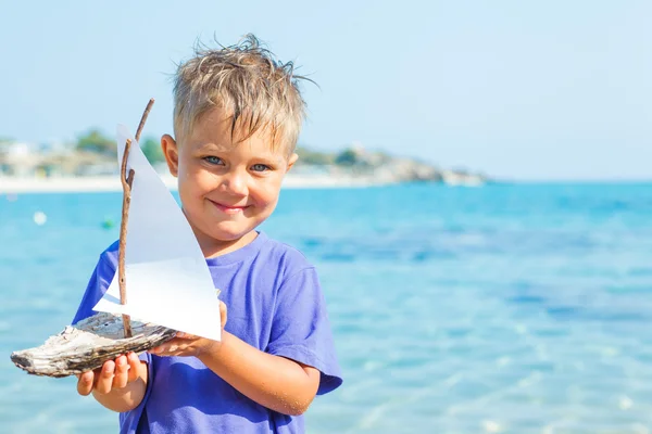 Boy with toy ship — Stock Photo, Image