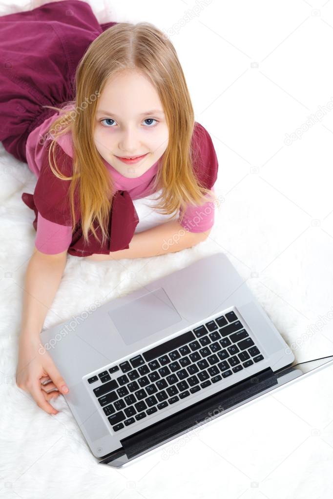 Young girl using notebook computer