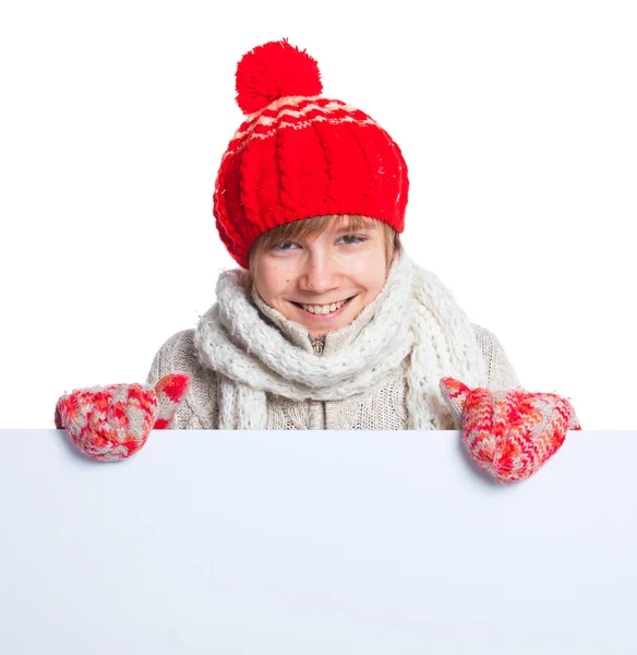 Teenager in winter style looking at a blank board — Stock Photo, Image