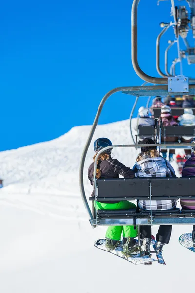 Skiers on a ski-lift — Stock Photo, Image