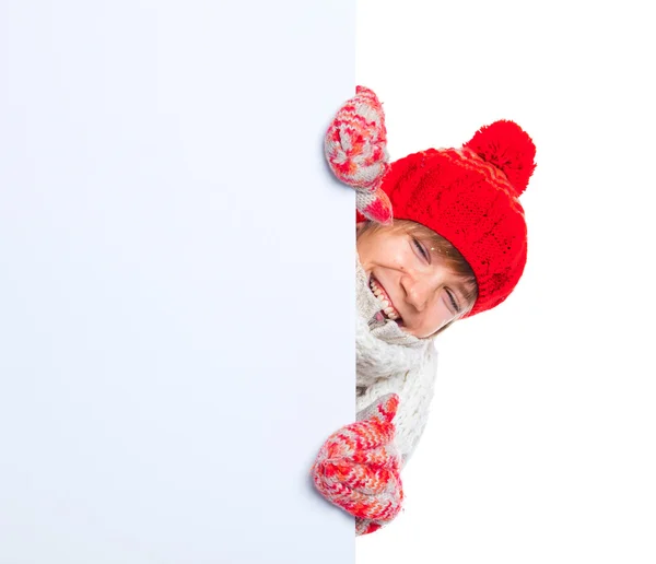 Teenager in winter style looking at a blank board — Stock Photo, Image