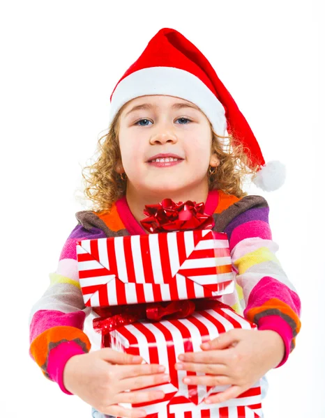 Mała dziewczynka kapelusz Świętego Mikołaja z pudełko — Zdjęcie stockowe