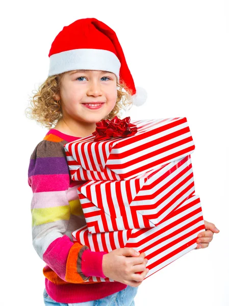 Little girl in Santa's hat with gift box — Stock Photo, Image