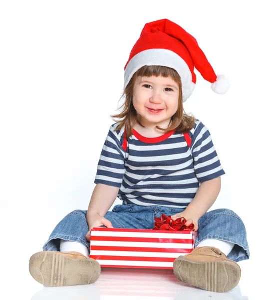 Niña en el sombrero de Santa con caja de regalo — Foto de Stock