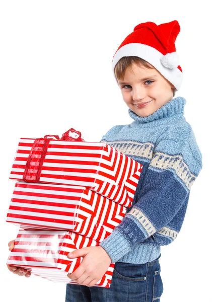 Menino no chapéu do Pai Natal com caixa de presente — Fotografia de Stock