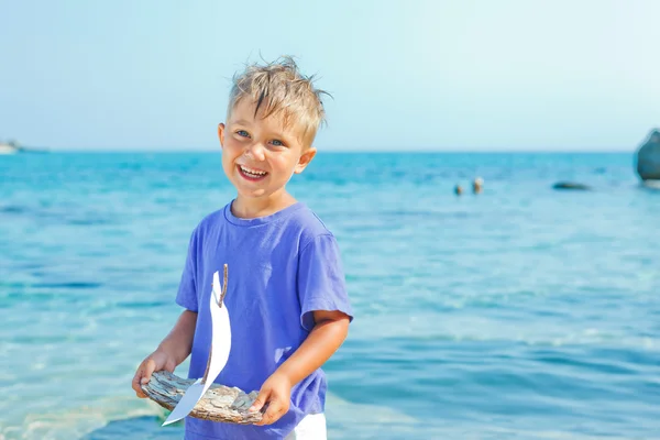 Boy with toy ship — Stock Photo, Image