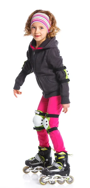 Leuk meisje in rolschaatsen — Stockfoto