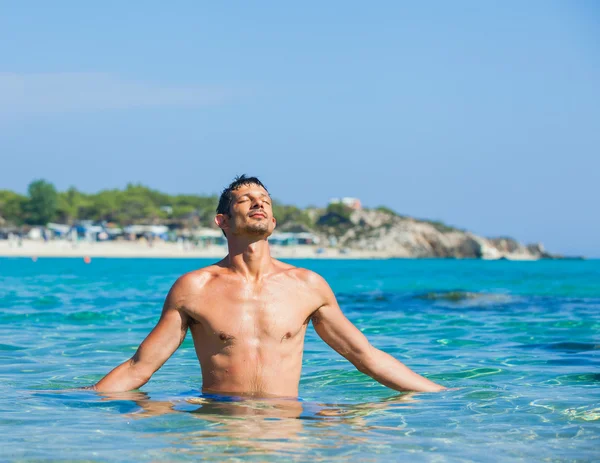 Young man in sea — Stock Photo, Image
