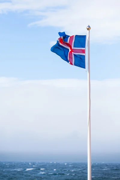 Icelandic Flag flying in summer seen against blue sky — Stock Photo, Image