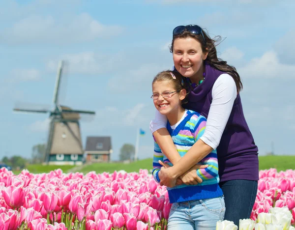 Boy with mother in the tulips field — Stock Photo, Image