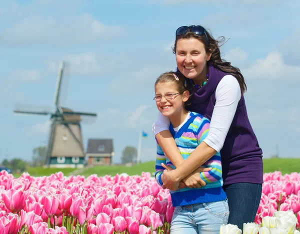 Boy with mother in the tulips field Stock Photo