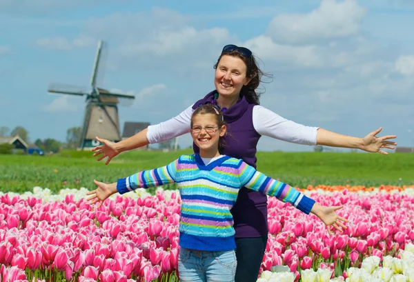 Boy with mother in the tulips field Royalty Free Stock Photos