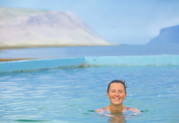 Smiling woman in bathing suit... — Stock Photo, Image