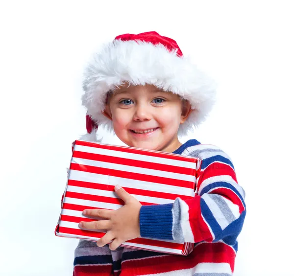 Malý chlapec v Santa klobouk s dárkový box — Stock fotografie