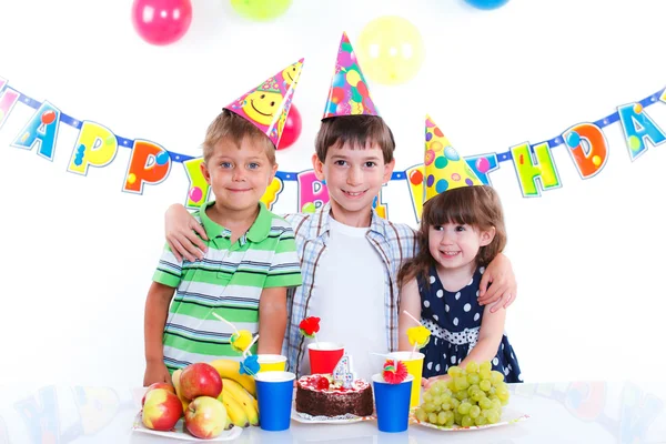 Kids with birthday cake Stock Image