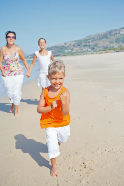 Cute boy with sister and mother on the beach — Stock Photo, Image