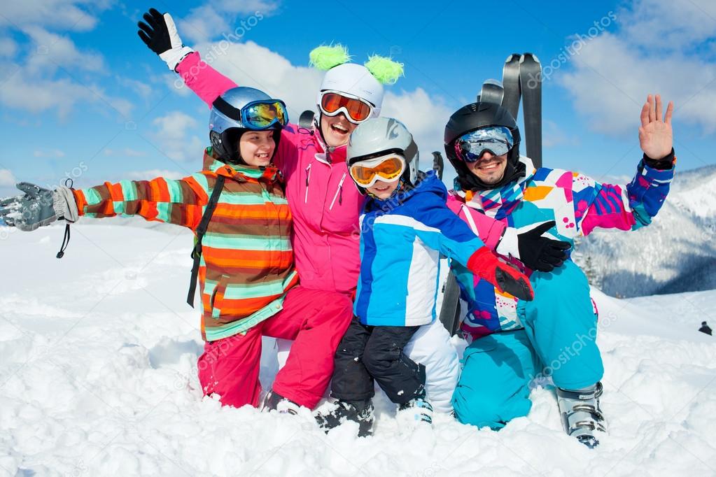 Skiing winter fun. Happy family