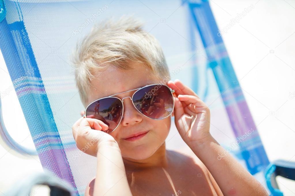 cute child relaxing on beach