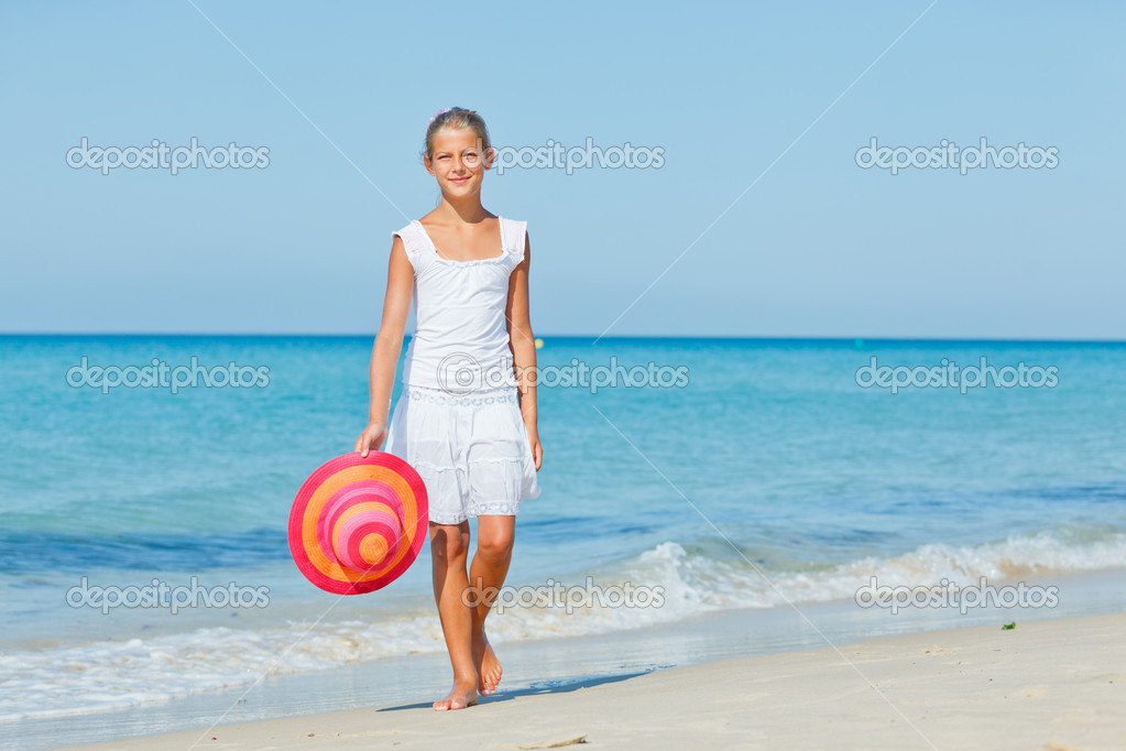 Girl with hat on the beach Stock Photo by ©mac_sim 32113831