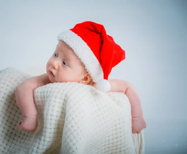 Baby in a santa suit. Stock Picture