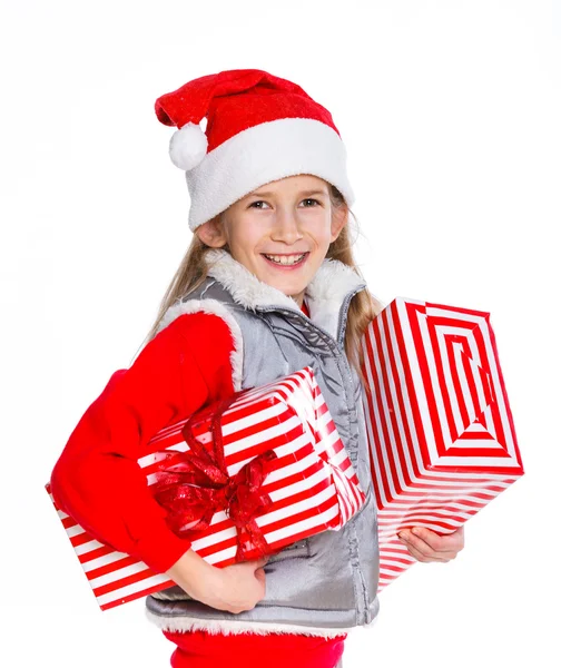 Ragazza in cappello di Babbo Natale con confezione regalo — Foto Stock