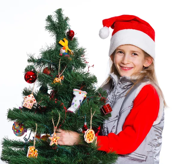 Girl decorating christmas tree. — Stock Photo, Image