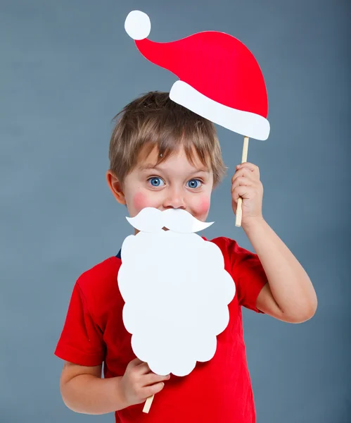 Kleine jongen in Kerstman hoed. — Stockfoto
