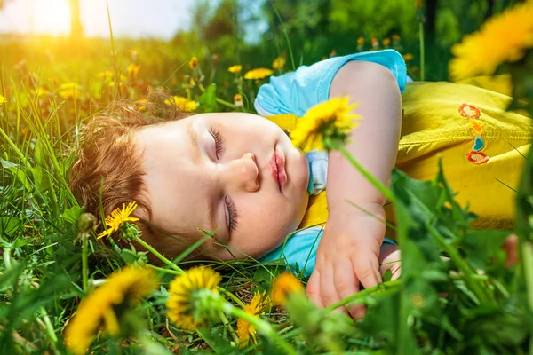 Sleeping boy on grass — Stock Photo, Image