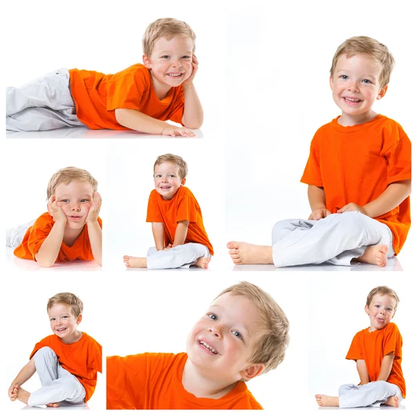 Happy boy sitting on the floor — Stock Photo, Image