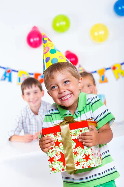 Boy with giftbox at birthday party — Stock Photo, Image