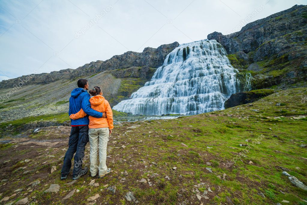 couple of tourists and Dynjandi. Iceland