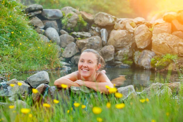 Woman in geothermal spring — Stock Photo, Image