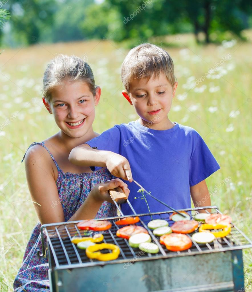 Kids having a barbecue party Stock Photo mac sim 47906871