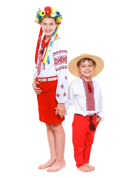 Flicka och en pojke i den ukrainska folkdräkt — Stockfoto