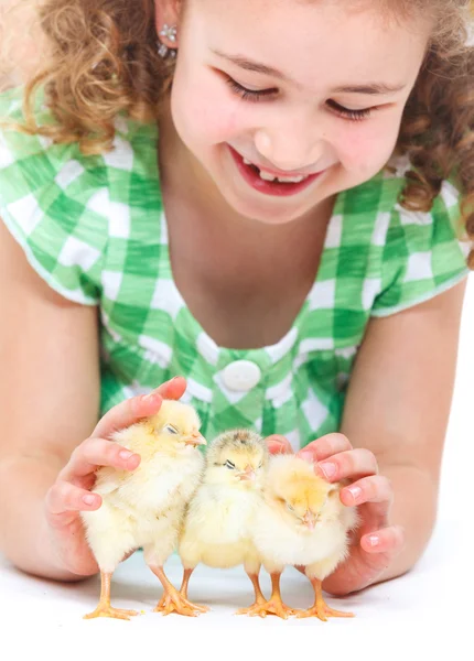 Happy little girl with chickens — Stock Photo, Image