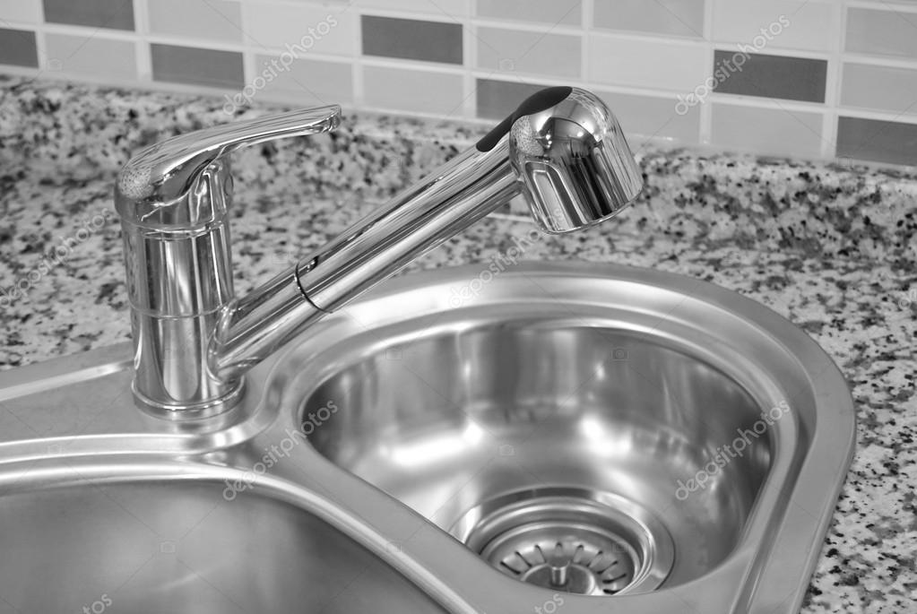 Modern Design Chrome Water Tap Over Stainless Steel Kitchen Sink.. Stock  Photo, Picture And Royalty Free Image. Image 143732911.