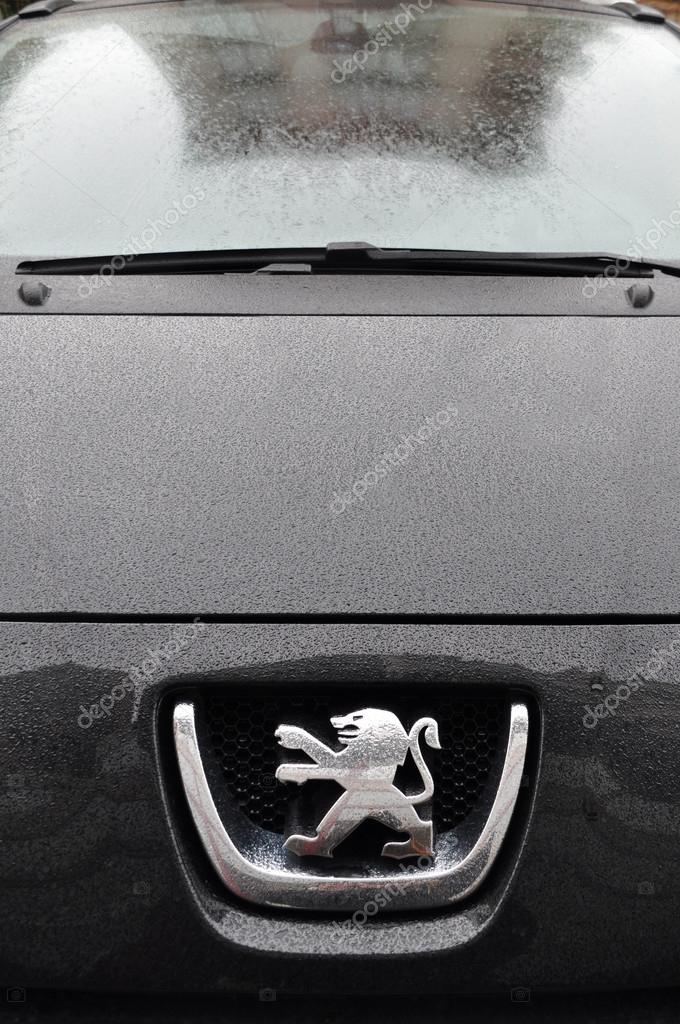Close-up Peugeot logo. Chrome metal