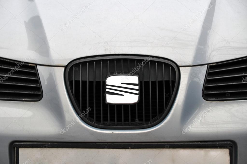 Close-up Seat logo. Chrome metal