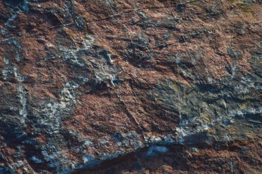 Çok sert kaya dokusu, doğal mavi ve kırmızı taş dokusu, arkaplan veya duvar kağıdı