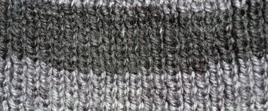 Yünden desenli kumaş. El yapımı örgü kumaş gri yün arkaplan dokusu