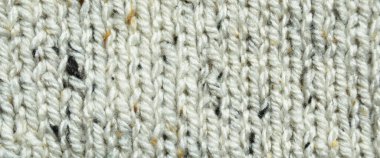 Yünden desenli kumaş. El yapımı örgü kumaş gri yün arkaplan dokusu