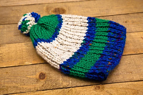 Handmade Wool Knitted Winter Blue Green White Hat Isolated Wooden — Stock Photo, Image