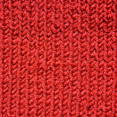 Yünden desenli kumaş. El yapımı kumaş, kırmızı yün arkaplan dokusu