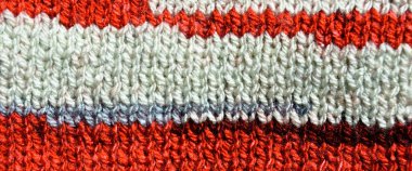 Yünden desenli kumaş. El yapımı kumaş, kırmızı ve beyaz yün arkaplan dokusu