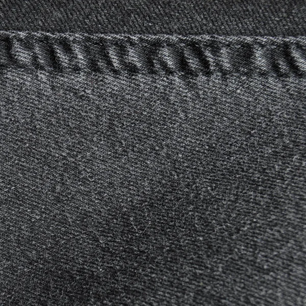 Dikiş siyah kot pantolon kumaş kumaş arka plan ve duvar kağıdı