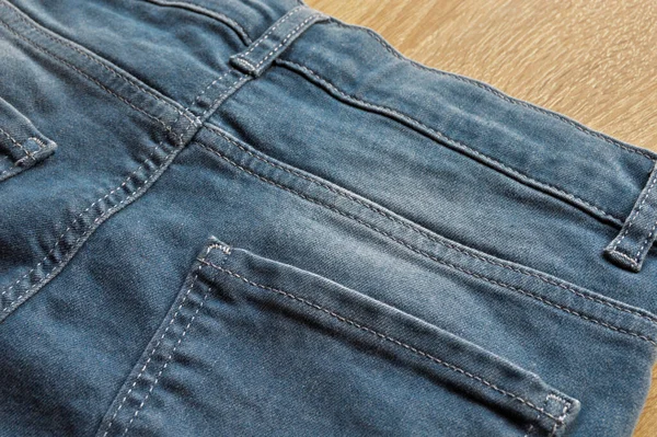 Close Detail Back Pocket Light Blue Jeans Denim Wooden Floor — Stock Photo, Image