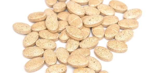 Beige Ovale Tabletten Auf Weißem Hintergrund Isoliert Medizinische Ovale Tabletten — Stockfoto