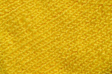 Yünden desenli kumaş. El yapımı örgü kumaş sarı yün arkaplan dokusu