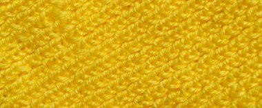 Yünden desenli kumaş. El yapımı örgü kumaş sarı yün arkaplan dokusu