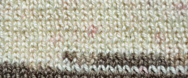 Yünden desenli kumaş. El yapımı örgü kumaş gri yün arkaplan dokusu